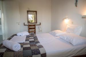 מיטה או מיטות בחדר ב-Eressos Ilios Apartments