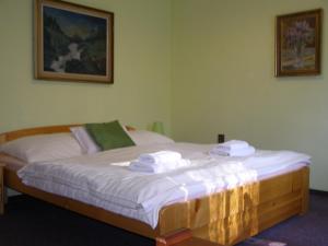 Posteľ alebo postele v izbe v ubytovaní Hotel Garni Belveder