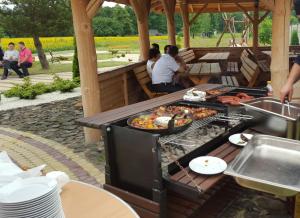 a grill with a bunch of food on it at Zajazd Orchidea - Lipsko - Hotel 24h in Lipsko