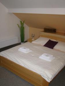 Posteľ alebo postele v izbe v ubytovaní Hotel Garni Belveder