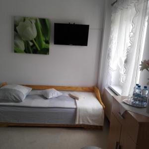 Postel nebo postele na pokoji v ubytování Biesiadny Dworek