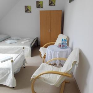 Postel nebo postele na pokoji v ubytování Biesiadny Dworek