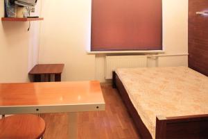 a room with a bed and a large screen at Apartments On Centralny Rynok in Kaliningrad