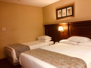 Cama ou camas em um quarto em Hotel Perula & SPA