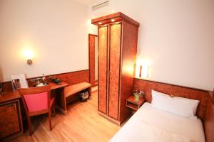 Postel nebo postele na pokoji v ubytování Hotel Miramar am Römer