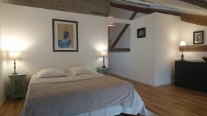 a bedroom with a large bed and two lamps at Mazet Des Artistes in Mouriès +73 photos