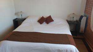 מיטה או מיטות בחדר ב-Apart Dry Fly