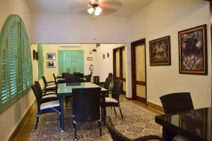 a dining room with a table and chairs at Casa Meba Hotel Boutique in Tampico