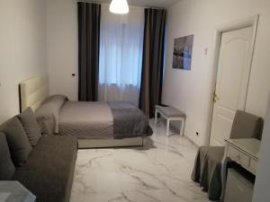 A bed or beds in a room at B&B Casa Nizza