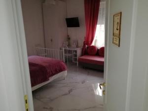 A bed or beds in a room at B&B Casa Nizza