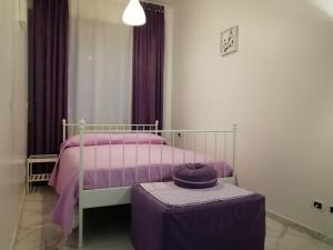 A bed or beds in a room at B&B Casa Nizza