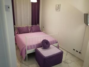 A bed or beds in a room at B&B Casa Nizza