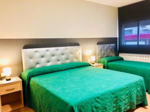 Cama o camas de una habitación en Hotel Viñas 17
