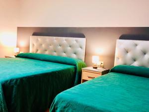 Cama o camas de una habitación en Hotel Viñas 17