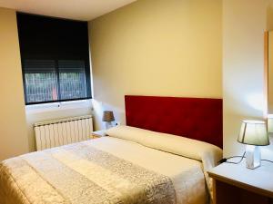 Cama o camas de una habitación en Hotel Viñas 17