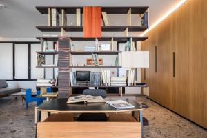 an office with a desk and a table and chairs at MaisonMe Boutique Hotel in Bardolino