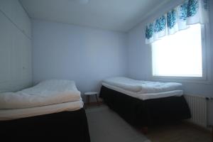 A bed or beds in a room at Jääskän Loma Ratatie 3 asunto 4, Kauhava