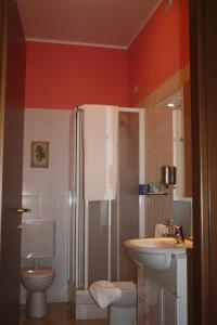 a bathroom with a sink and a shower and a toilet at Park Hotel in Chieri