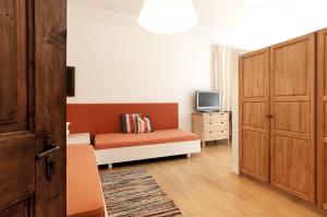 TV a/nebo společenská místnost v ubytování Residence Fink Central Apartments