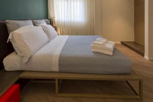 Postel nebo postele na pokoji v ubytování In Dies Affittacamere
