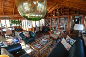 a living room with a large glass ball hanging from the ceiling at Inn at Huntingfield Creek in Rock Hall