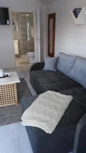 a living room with a couch and a table at Azalia 32 Mielno l in Mielno