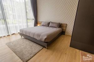 Postel nebo postele na pokoji v ubytování Baan Mai Khao Condominium