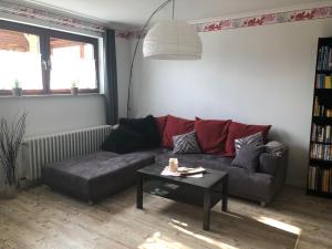 a living room with a couch and a table at Ferienwohnung Liebing in Bad Sachsa