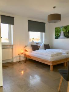 En eller flere senge i et værelse på City Apartment