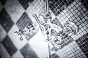 a close up of a bathroom sink faucet at Hôtel de Joséphine BONAPARTE in Paris +15 photos