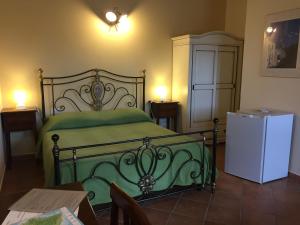 Postel nebo postele na pokoji v ubytování Agriturismo Arangèa