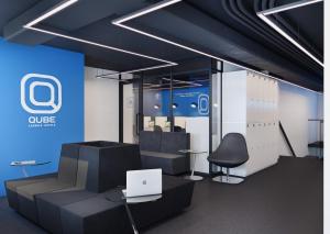 a conference room with a laptop on a table and chairs at Qube Capsule Hotel in Moscow