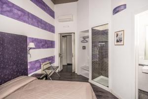 Posteľ alebo postele v izbe v ubytovaní Al Bastione di Cagliari
