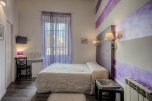 Posteľ alebo postele v izbe v ubytovaní Al Bastione di Cagliari
