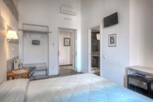 Posteľ alebo postele v izbe v ubytovaní Al Bastione di Cagliari