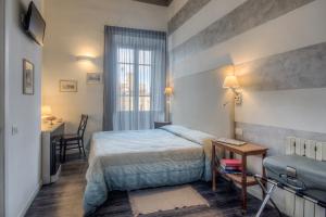 Posteľ alebo postele v izbe v ubytovaní Al Bastione di Cagliari