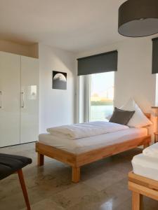 En eller flere senge i et værelse på City Apartment