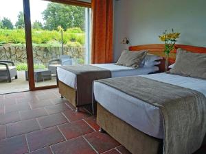 Ein Bett oder Betten in einem Zimmer der Unterkunft Hotel Pucon Green Park