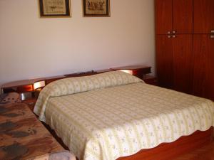 a bedroom with a bed and a dresser at Apartment Jadranka in Olib