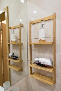 a room with two shelves with a hair dryer at City Apartments in Sofia