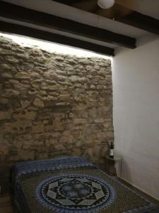 Łóżko lub łóżka w pokoju w obiekcie LA MIRILLA SUITES 3