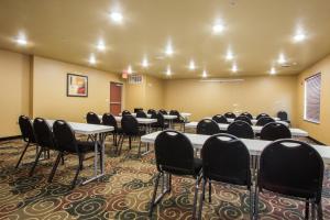 a conference room with tables and chairs in it at Cobblestone Inn & Suites - Corry in Corry