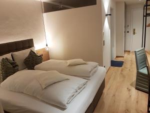 Ένα ή περισσότερα κρεβάτια σε δωμάτιο στο Hotel Kranebitt