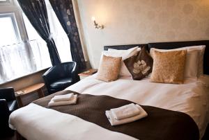 Кровать или кровати в номере Woodthorpe Hotel
