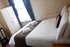 Postel nebo postele na pokoji v ubytování Woodthorpe Hotel