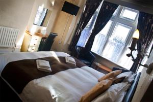 Postel nebo postele na pokoji v ubytování Woodthorpe Hotel