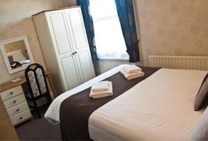 Postel nebo postele na pokoji v ubytování Woodthorpe Hotel