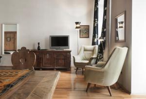 TV a/nebo společenská místnost v ubytování Residence Fink Central Apartments