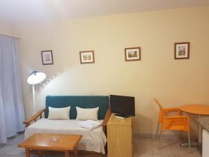 Łóżko lub łóżka w pokoju w obiekcie Apartamentos Olympia Garden