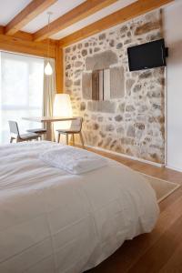 A bed or beds in a room at Ureta Landa Gaztelugatxe